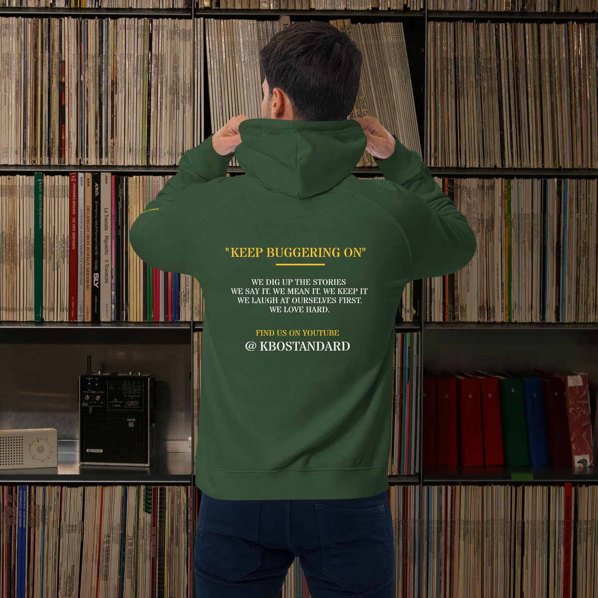 “Keep Buggering On” Premium Eco Raglan Hoodie, bottle green, back view